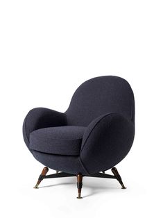 an upholstered chair with dark blue fabric and wooden legs, on a white background