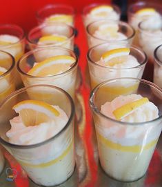 there are many glasses filled with lemonade and ice cream on the table in front of each other