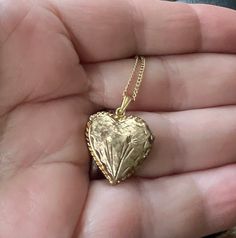 Vintage 12K GF Gold Filled Heart Shaped Engraved Names 1974  Locket Necklace 18" Offered here is a vintage 12k GF gold filled darling heart shaped engraved flower locket necklace measuring; 18" long. The locket is 1.5" x 1.5". It opens on a hinge to reveal 2 compartments for photographs. Engraved :Love Suzzy Sharron Boris 12-26-74 The bail is stamped 12K Gold Filled, but it is too small to photograph.   In nice, sturdy, excellent condition and may have very minimal age related wear Weighs; .14oz Heart Shaped Locket Aesthetic, Affordable Vintage Heart-shaped Jewelry, Vintage Gold Heart Locket, Antique Jewelry For Valentine's Day Anniversary Gift, Antique Jewelry For Anniversary Gift On Valentine's Day, Collectible Gold Jewelry With Heart Charm, Collectible Yellow Gold Necklace With Heart Charm, Collectible Gold Heart Pendant Jewelry, Hallmarked Medallion Jewelry For Valentine's Day