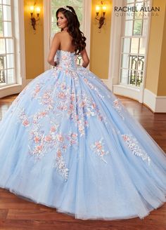 Look super cute in this 3D floral applique long cape sleeve dress with A-line skirt by Rachel Allan RQ2161. Glitter tulle quinceanera ball gown with strapless sweetheart neckline, detachable streamers, embroidery applique, 3D flowers, beads, lace-up back closure, and sweep train. 3D Floral Cape Sleeve Quinceanera Dress by Rachel Allan RQ2161 Rachel Allan La Reina Collection: Spring 2023 Style Number: RQ2161 Fabric: Tulle, Glitter Tulle, Sequin Beading, Embroidery, 3D Flowers Please note: There m Floral Cape, Cape Sleeve Dress, Rachel Allan Prom Dresses, Mary's Bridal, Embroidery 3d, Cinderella Divine, Quince Dress, Dresses Quinceanera, Strapless Sweetheart Neckline