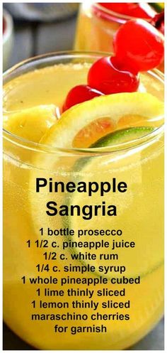 pineapple sangria recipe in a glass with limes and cherries