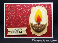 a diwali card with a lit candle in the middle on a red background