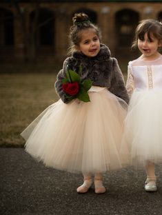 Flower Girl Fur Jacket This lavish faux fur bolero for little girls is deliciously soft and will make them look elegant for winter weddings or holiday black tie events. Faux Fur Bolero Details: ~A coat for the Luxury Winter Wedding Flower Girl Collection ~Ultra Soft Faux Fur (Brown) ~100% Silk Charmeuse Lining ~Long Sleeves ~Collar ~Hidden Hook & Eye Enclosures in Front (If you would like a different enclosure style (such as ribbons), please contact Mary Grace.) ~Handmade in America at Anagrassi Flower Girl Winter Wedding, Flower Girl Dresses Winter, Winter Flower Girl Dresses, Winter Wedding Flower Girl, Winter Flower Girl Dress, Luxury Winter Wedding, Winter Flower Girl, Cold Wedding, Faux Fur Bolero