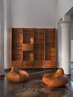 Pictured here is a majestic bookcase is designed by Studio B.B.P.R. and manufactured by Pierino Frigerio in Cantù. This design by B.B.P.R. is truly enchanting, the wonderful detailing in the drawers, the richness of the walnut, the playful brass feet and the sheer height make this one of our favourite pieces in the showroom. The bookcase is here combined with a pair of Dutch lounge chairs from the 1980s. Dutch Design, Design Gallery, Be Inspired, Midcentury Modern, Italian Design, Christmas Presents, Last Minute, 20th Century, Showroom