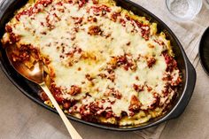 a casserole dish filled with meat and cheese