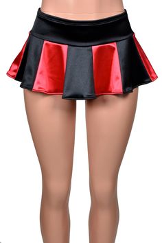 Mannequin wearing stretch satin micro mini skirt. Skirt has a 3 inch wide low rise waistband. Lower part of skirt is flared with a total of 12 panels. 6 panels are black, 6 panels are bright red. Fitted Satin Short Length Bottoms, Fitted Satin Mini Bottoms, Fitted Satin Mini Skirt, Flirty Stretch Skort For Club, Red Satin Party Bottoms, Red Stretch Skirt For Costume Party, Stretch Mini Skirt For Costume Party, Red Fitted Skort For Party, Black Fitted Satin Mini Skirt