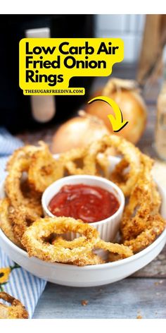 a bowl filled with fried onion rings next to ketchup on a plate and an advertisement for low carb air fries