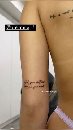 the back of a woman's left arm with writing on it