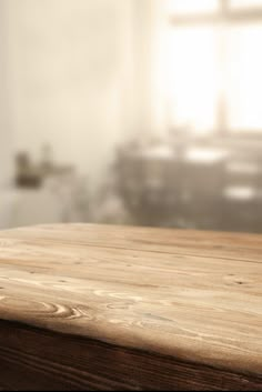 a wooden table top with blurry background