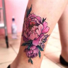 a close up of a person's foot with pink flowers on the bottom of it