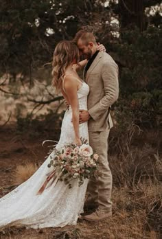 a bride and groom standing together in the woods for their wedding photo shoot on instagram