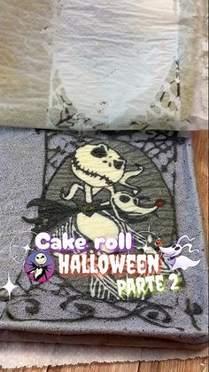 there is a cake roll on the floor with halloween decorations and stickers all over it