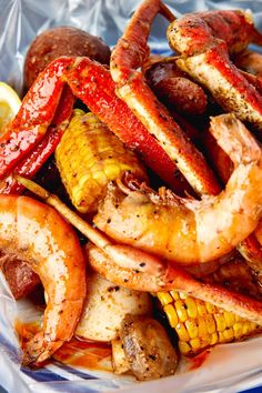 cooked shrimp and corn on the cob