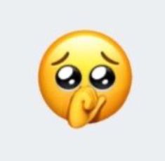 a yellow emoticure with eyes and nose