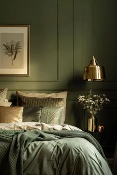 a bedroom with green walls and gold accents