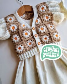 a crochet pattern for a baby's sweater and dress with flowers on it