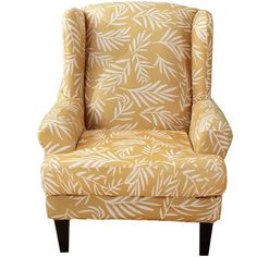 an upholstered yellow chair with white leaves on the back and arms, against a white background