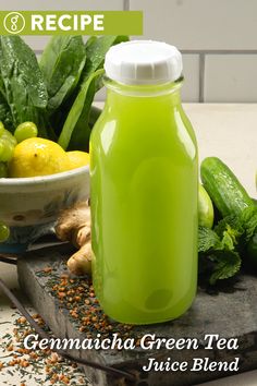 a green tea in a glass bottle surrounded by vegetables