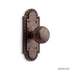 an antique style door handle with beading on the front and back of it's knob