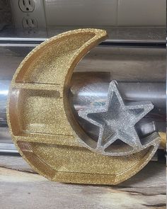 a metal object with a star and moon on it