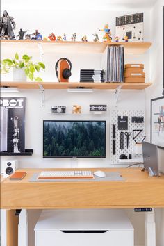 a desk with a computer, keyboard and mouse on it in front of bookshelves