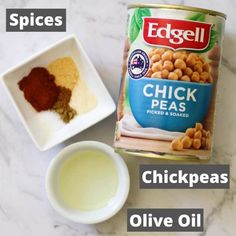 ingredients for chicken peas and olive oil on a marble counter top with text overlay