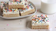 there are several pieces of cake with sprinkles on it