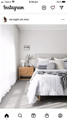 an instagram photo of a bedroom with white walls and grey bedding, along with the text instagram