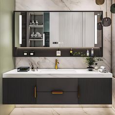 a modern bathroom with marble counter tops and gold accents on the mirror above the sink