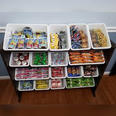 an organized food storage unit in the corner of a room