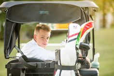 a man sitting in the back of a golf cart