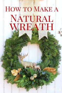 a christmas wreath hanging on the side of a door with an antler and deer decoration