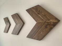 three pieces of wood sitting next to each other