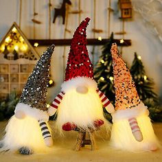 three christmas gnomes sitting on top of each other