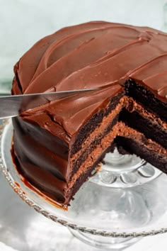 a chocolate cake with one slice missing from it