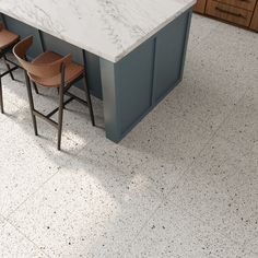 three chairs sitting at a counter in a kitchen