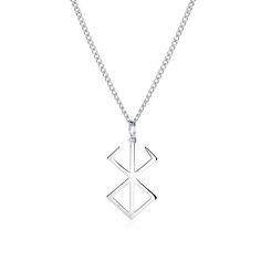 a silver necklace with an arrow and cross on the front, hanging from a chain