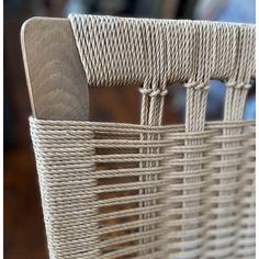 a close up of a wicker basket with handles