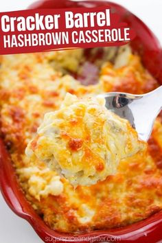 a spoonful of cracker barrel hashbrown casserole in a red dish