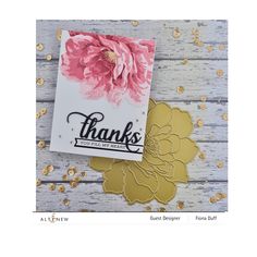 a thank card with gold foil flowers on it and the words thanks written in black ink