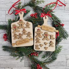 two wooden christmas ornaments with gingerbreads on them