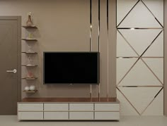 an entertainment center with a flat screen tv mounted on the wall and shelving unit