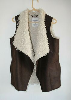 Aeropostale Women's S Faux Suede Sherpa Lining Brown Vest Draped Warm Open Front. With 2 pockets. This listing is for an Excellent Pre-Owned faux leather/sherpa vest from Aeropostale.  Size is Small.  100% Machine Washable Polyester. Super cute with leggings and boots and a plaid shirt! Please look at the photos as I took a lot and should serve as part of my description.  Any questions please ask. I always answer within 24 hrs. Feedback left after feedback is received. Feel free to browse my sto Sherpa Vest, Brown Vest, Sherpa Lined, Aeropostale, Front Open, Plaid Shirt, Faux Suede, Sleeveless Top, Super Cute