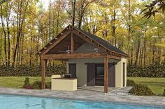 an outdoor kitchen next to a pool in the middle of a wooded area with trees