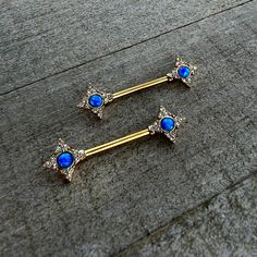 14 Gauge 9/16 Blue Synthetic Opal Gold Tone Rhombus Nipple Ring Set - Surgical Grade Stainless Steel - Body Candy Opal Piercing Jewelry, Piercing Nibbles, Breast Piercing Ring, Nip Piercings Chain, Nip Piercings Rings, Industrial Piercing Jewelry Opal, Internally Threaded Jewelry, Synthetic Opal, Fancy Jewelry