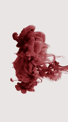 red ink in water on white background