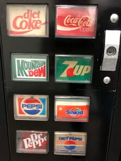 a vending machine with several different types of sodas on it's side