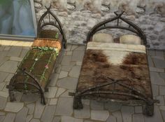 two beds made out of wood and metal with cow hide rugs on the floor