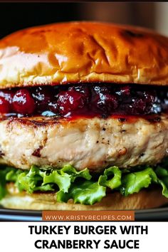 a turkey burger with cranberry sauce on it