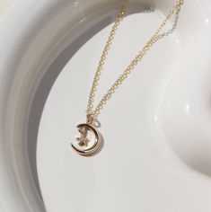 Meet the Moon + Star Charm Necklace. She symbolizes feminine energy aligned with the eternal mysteries in life. DETAILS 14k gold fill chain with 14k gold plated charmAvailable in 16" and 18" lengths To keep your charm looking beautiful, we recommend removing the necklace before swimming, showering or sleeping. Star Charm Necklace, Forever Jewelry, Childrens Jewelry, Moon Star, Feminine Energy, Star Charms, Gold Filled Chain, Stars And Moon, Ring Necklace